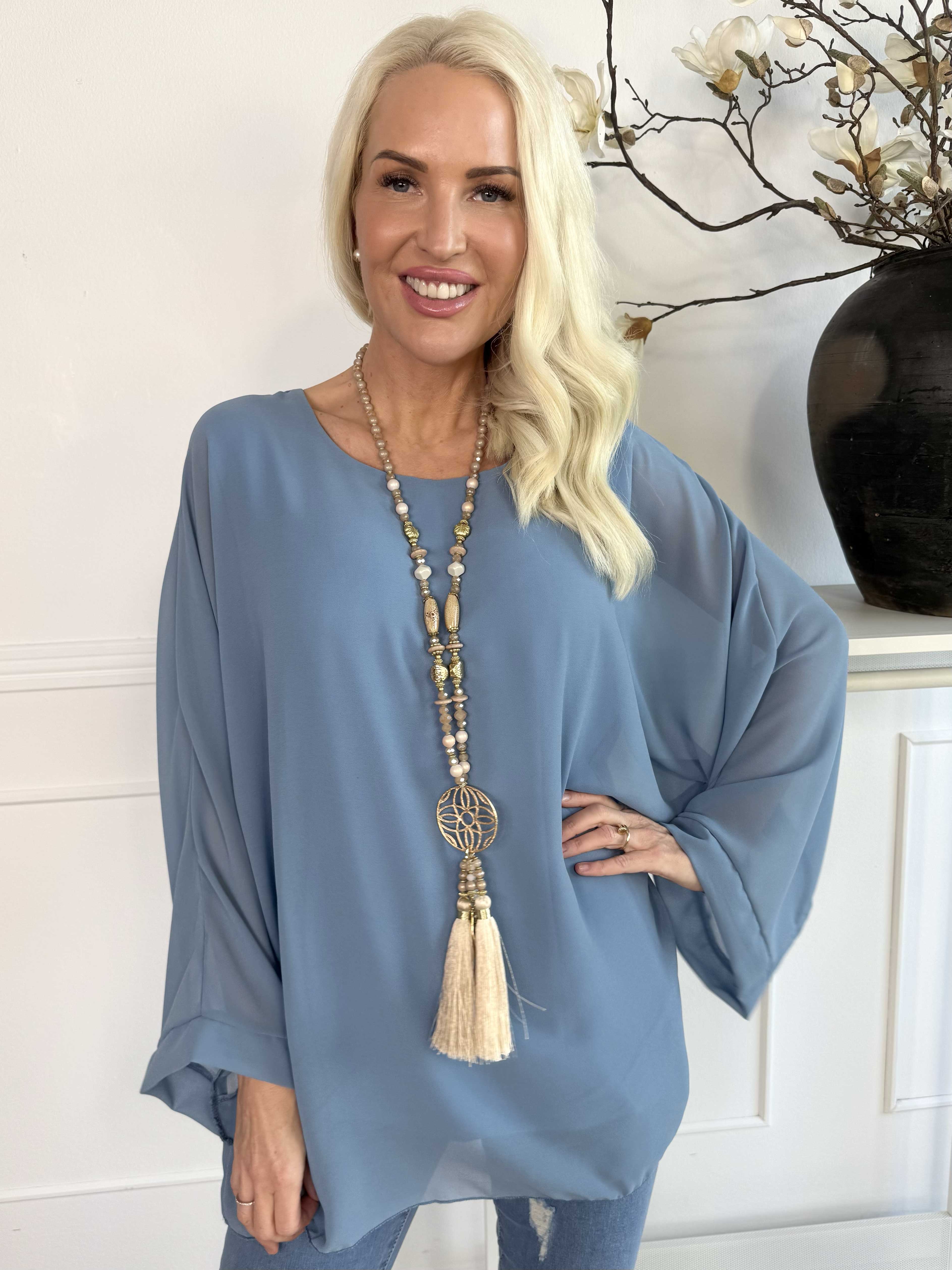 Flores - Tunika med chiffonglager och halvgenomskinliga ärmar